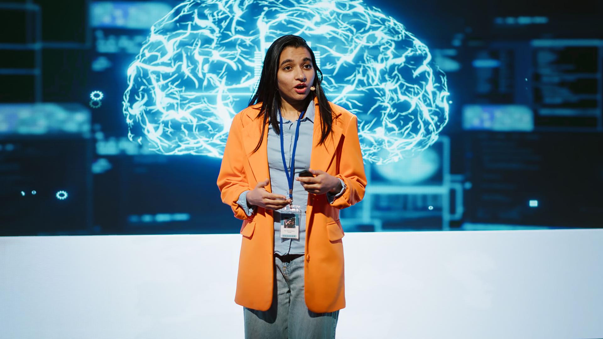 Speaker talking with audience on stage at AI conference